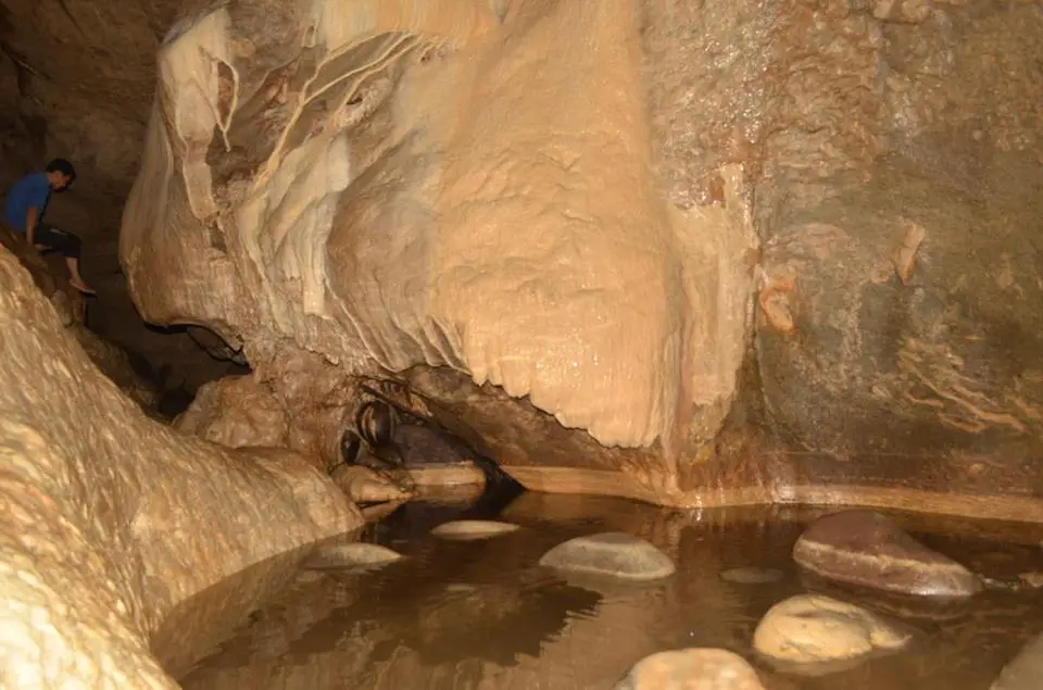 Glistening pool of Longog cave.