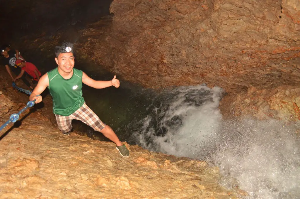 Climbing the first waterfall in Aran Cave, Tuba.